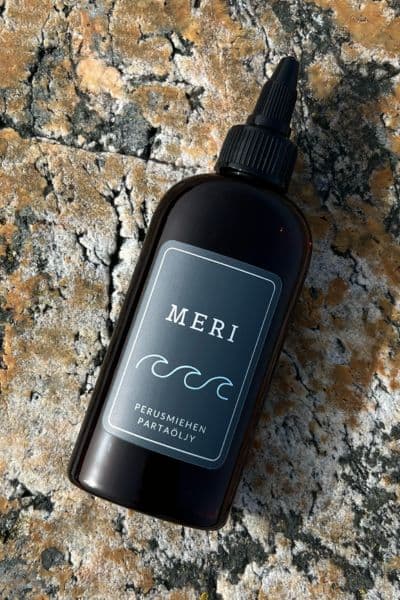 Meri beard oil bottle on granite surface